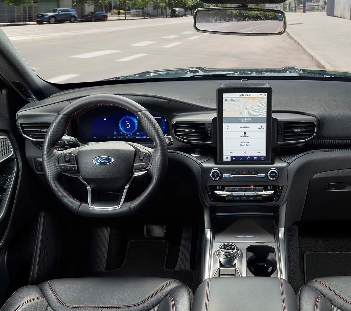 Ford Mondeo interior front viewed from back with person sitting in driver seat checking rear view camera