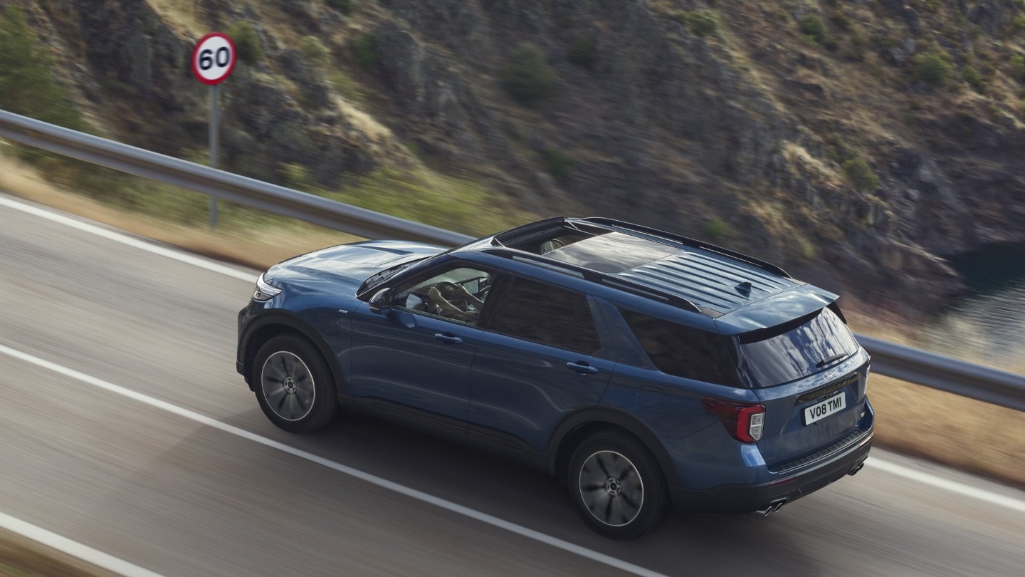 Ford Explorer driving on mountain road bird's eye view