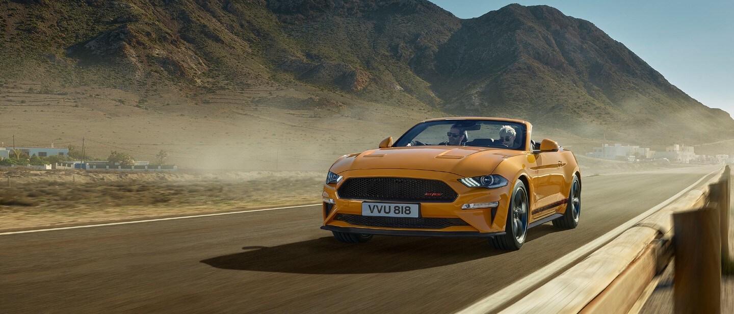 Ford Mustang California Edition driving down a California road.