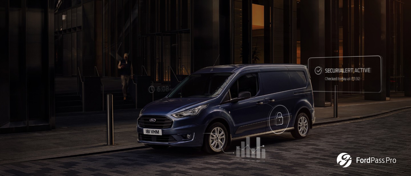 Blue Ford Transit Connect driving in city