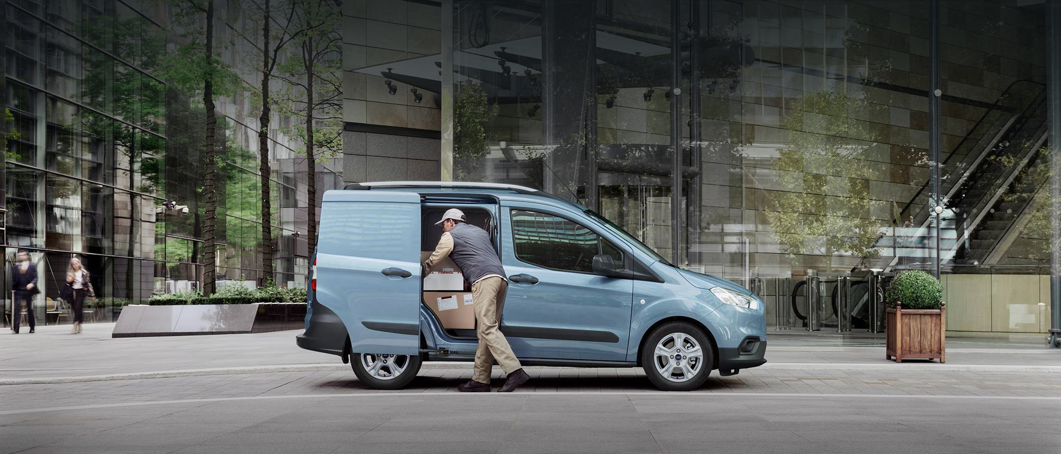 Ford Transit Courier with delivery man
