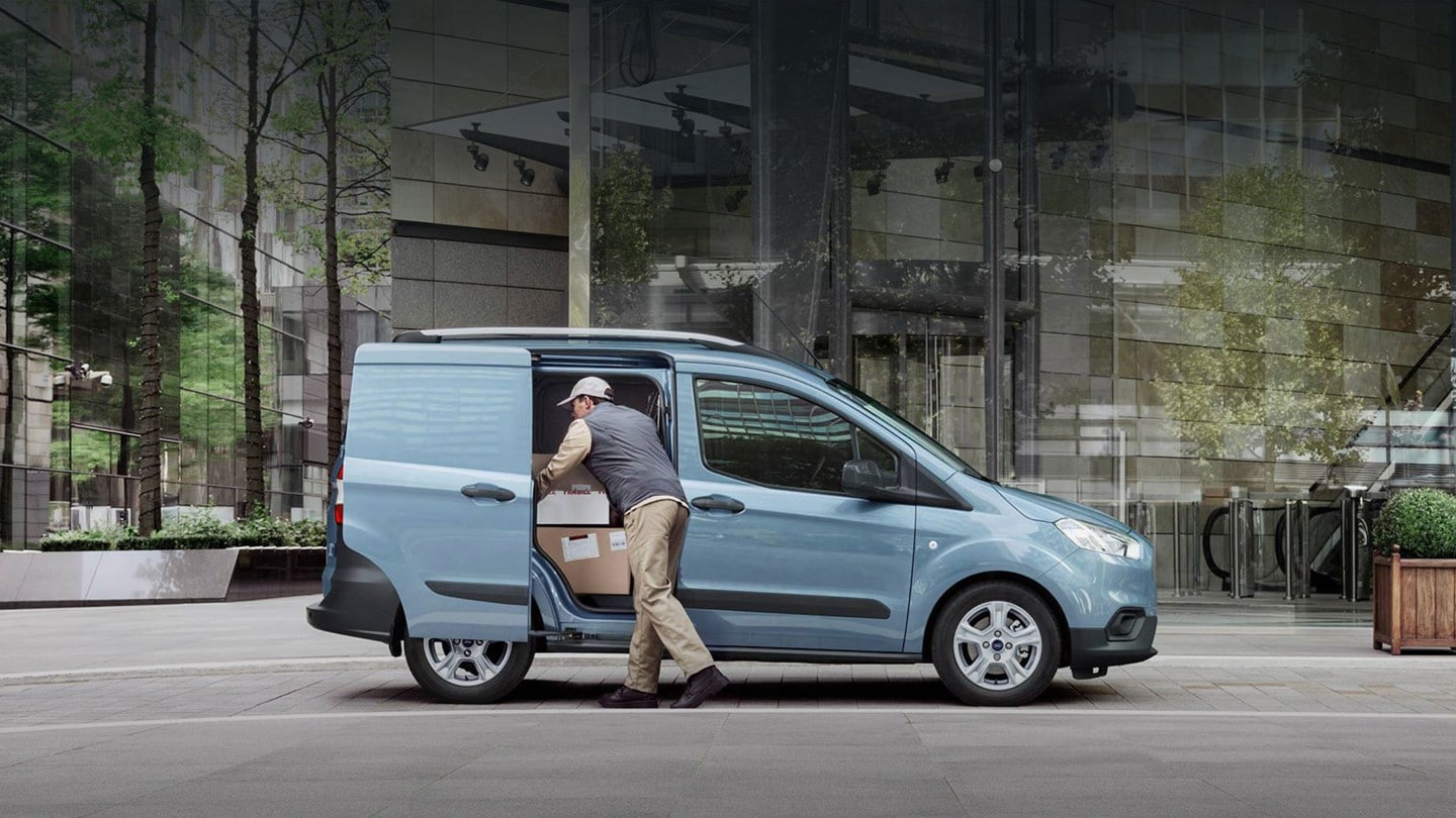 Courier unloading Ford van