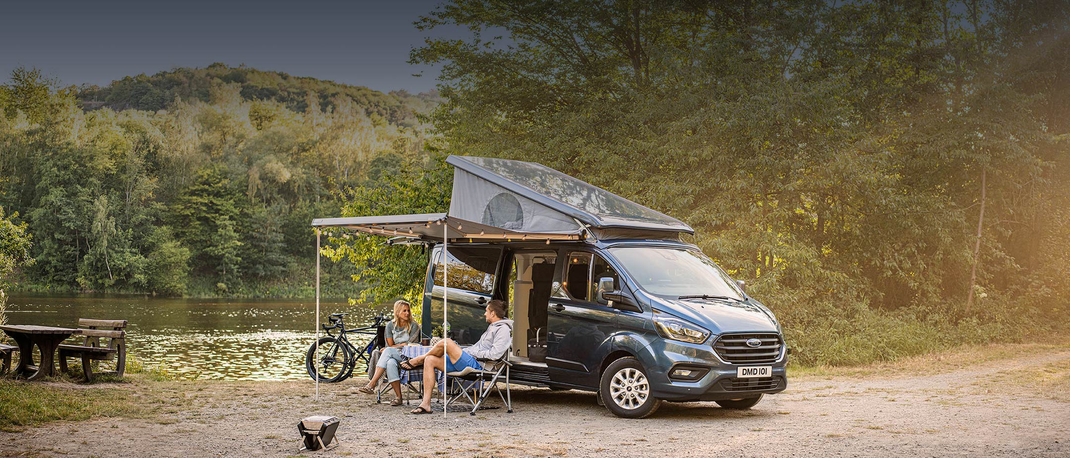 New Transit Custom Nugget Plus parked on grass near mountains