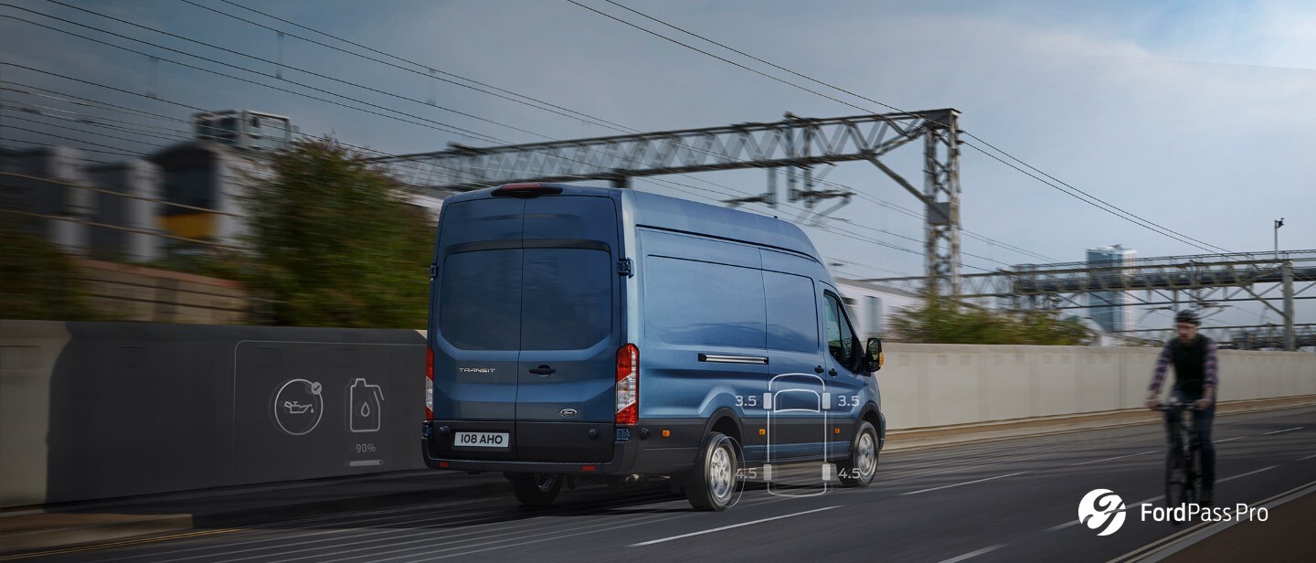 New Blue Ford Transit Van rear view on road