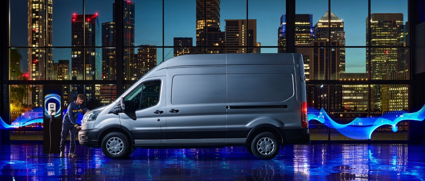 Ford E-Transit side view against night city backdrop