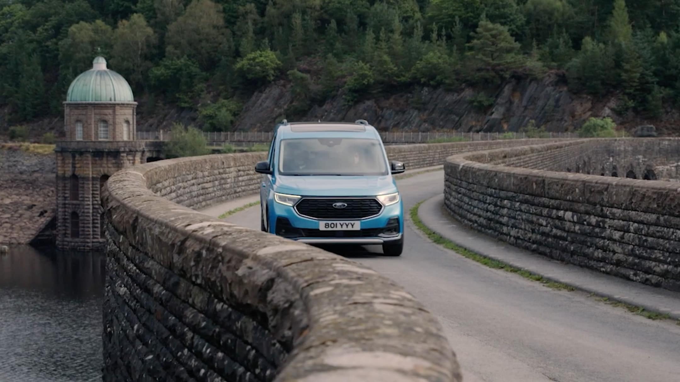 Ford Transit Connect driving over bridge