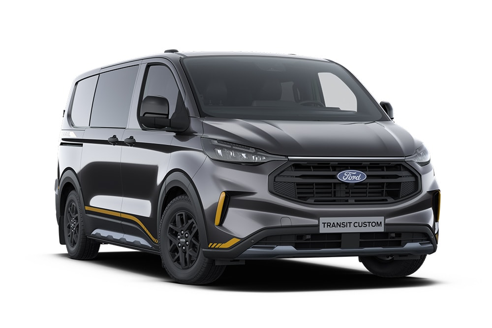 Donkergrijze Trail Ford Transit Custom bestelwagen met gouden accenten.