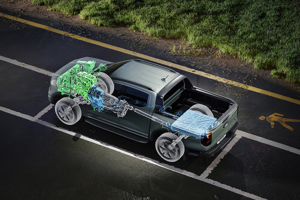 Ford Ranger geparkeerd naast een grasveld, met een binnenaanzicht met focus op de interieurmechanica.