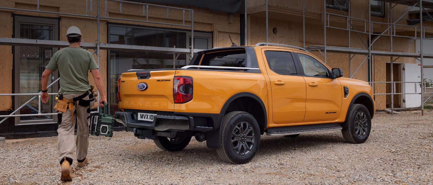 All-New Ford Ranger parked by construction 3/4 rear view