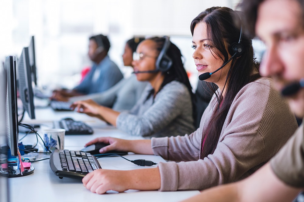 A Ford call centre team wearing headsets.