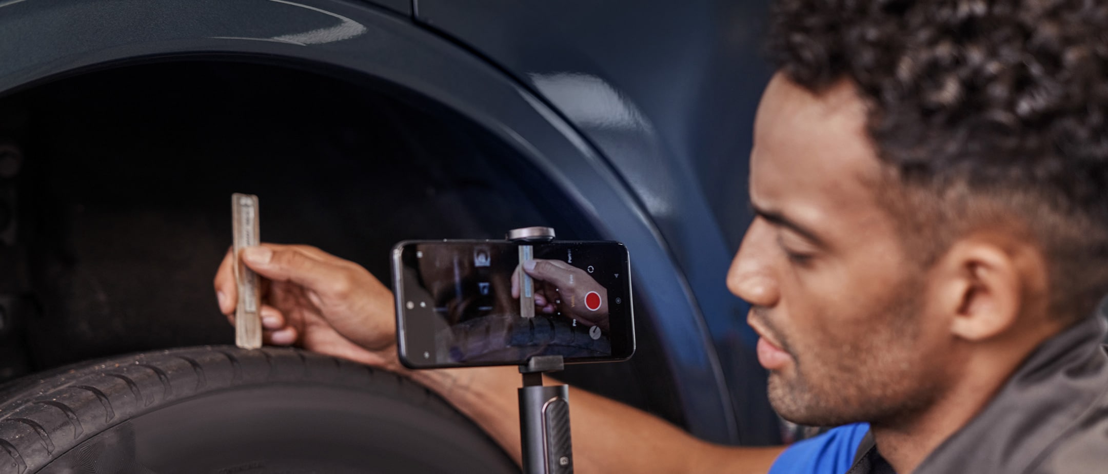 Man filming Kuga on his phone